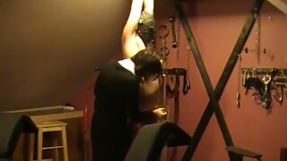 Masked submissive male slave tied up and tortured