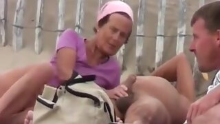 tapes multiple nudist couples having sex at a nudist beach