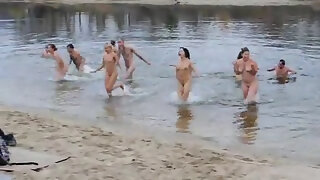 Group skinny dip shows naked boobs